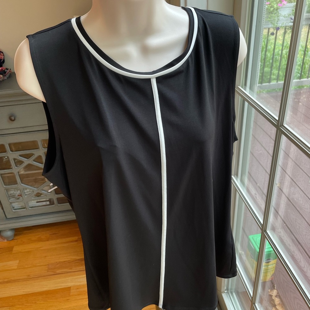 Black and white sleeveless blouse.